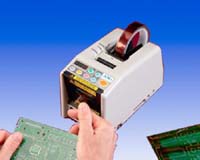 small square tape despenser- cuts and holds a single piece of tape at a time.